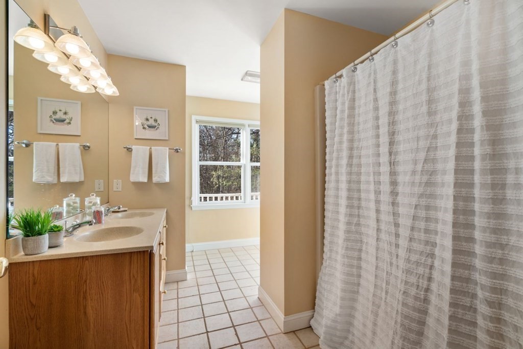 9 R Conant Street Acton, MA 01720 - Photo 28 of 42 a bathroom with a sink and a mirror