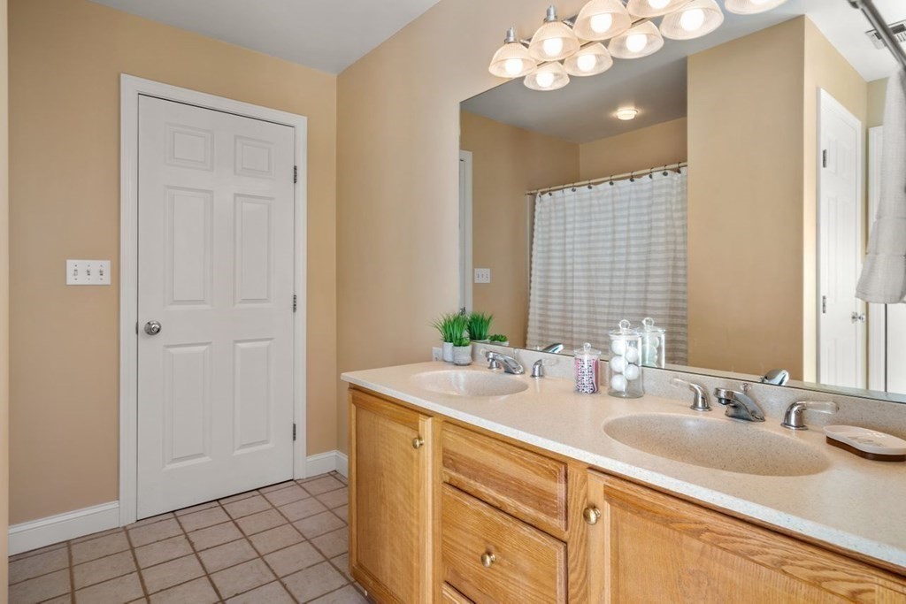 9 R Conant Street Acton, MA 01720 - Photo 30 of 42 a bathroom with a sink and a mirror