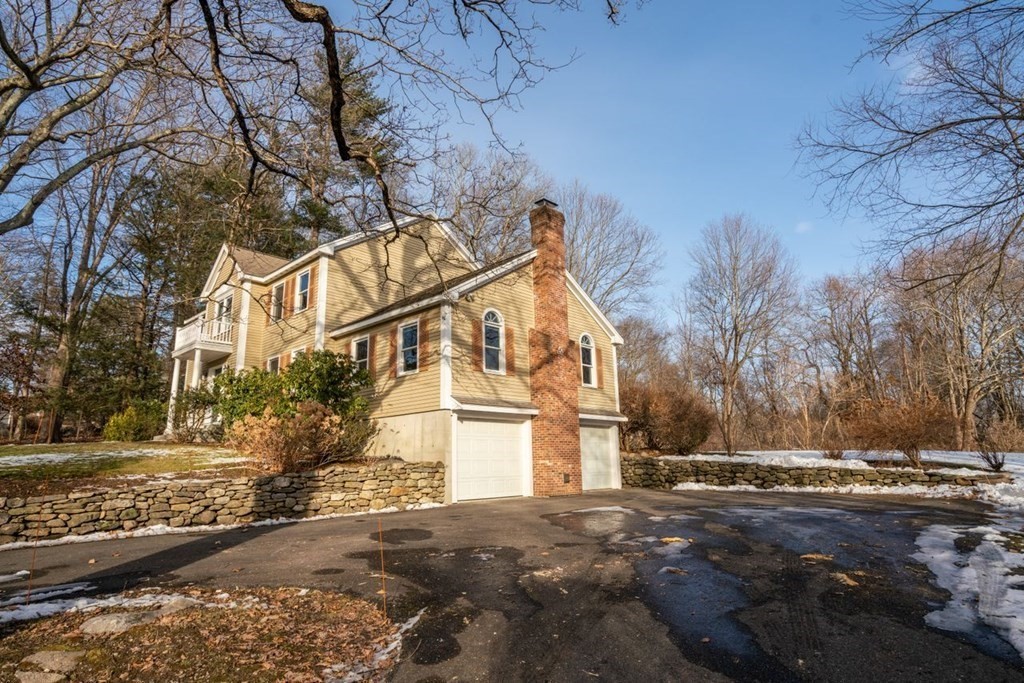 9 R Conant Street Acton, MA 01720 - Photo 4 of 42 a view of a house with a snow in the yard