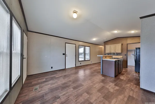a kitchen with a stove a sink and a refrigerator