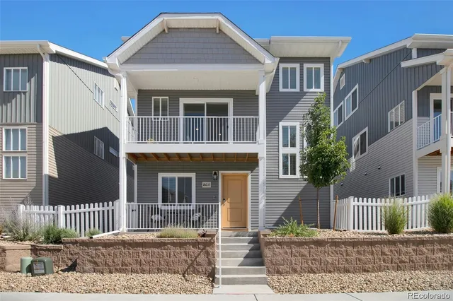 a front view of a house with a porch