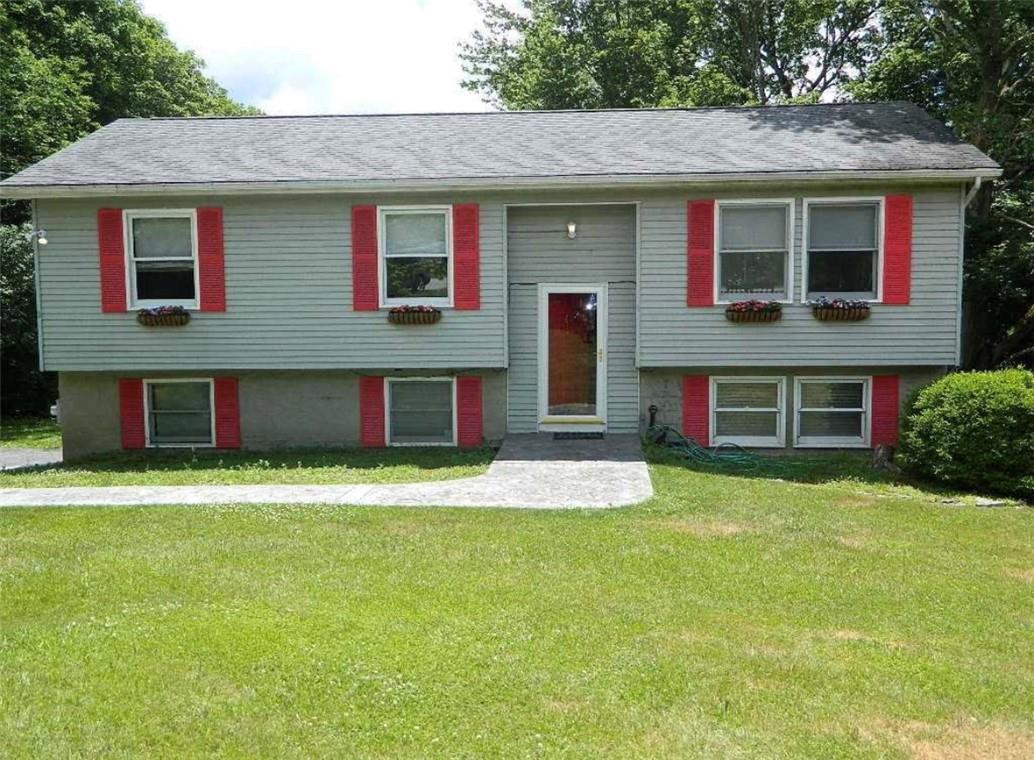 a house that has a big yard in front of it