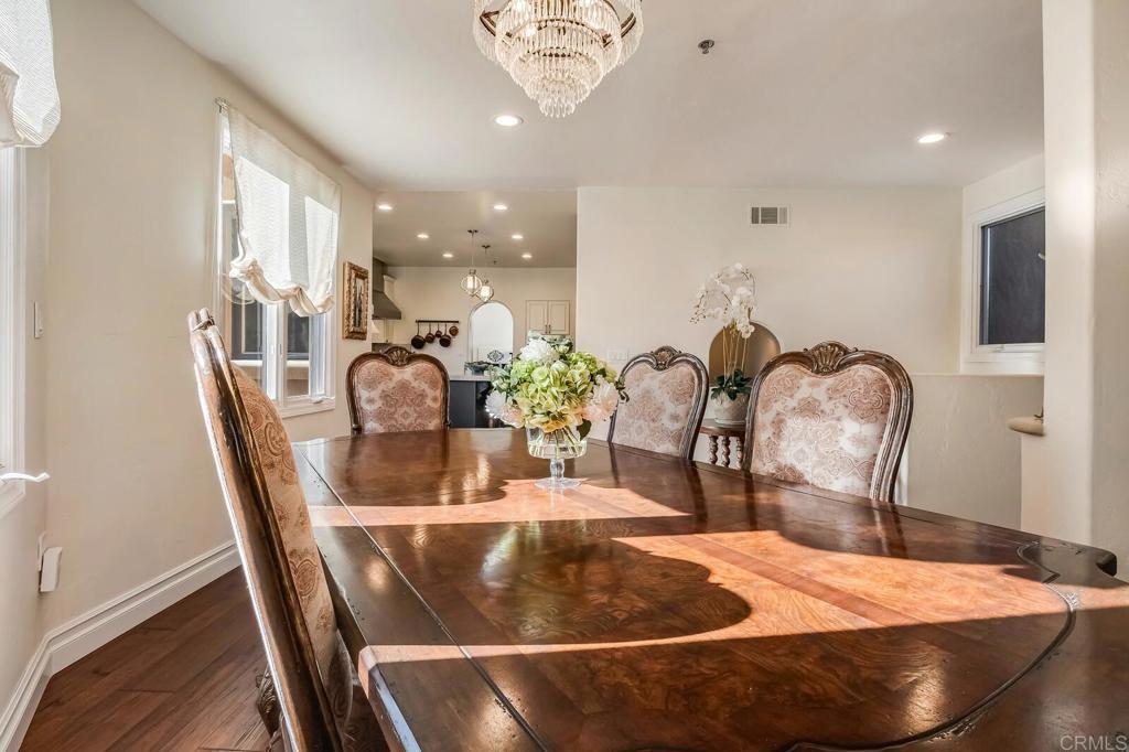 136 Hummingbird Hill Encinitas, CA 92024 - Photo 12 of 54 a dining room with furniture and wooden floor