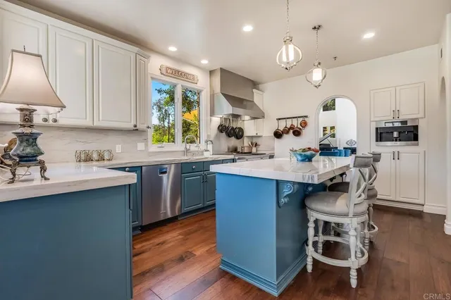 a kitchen with a sink cabinets and window