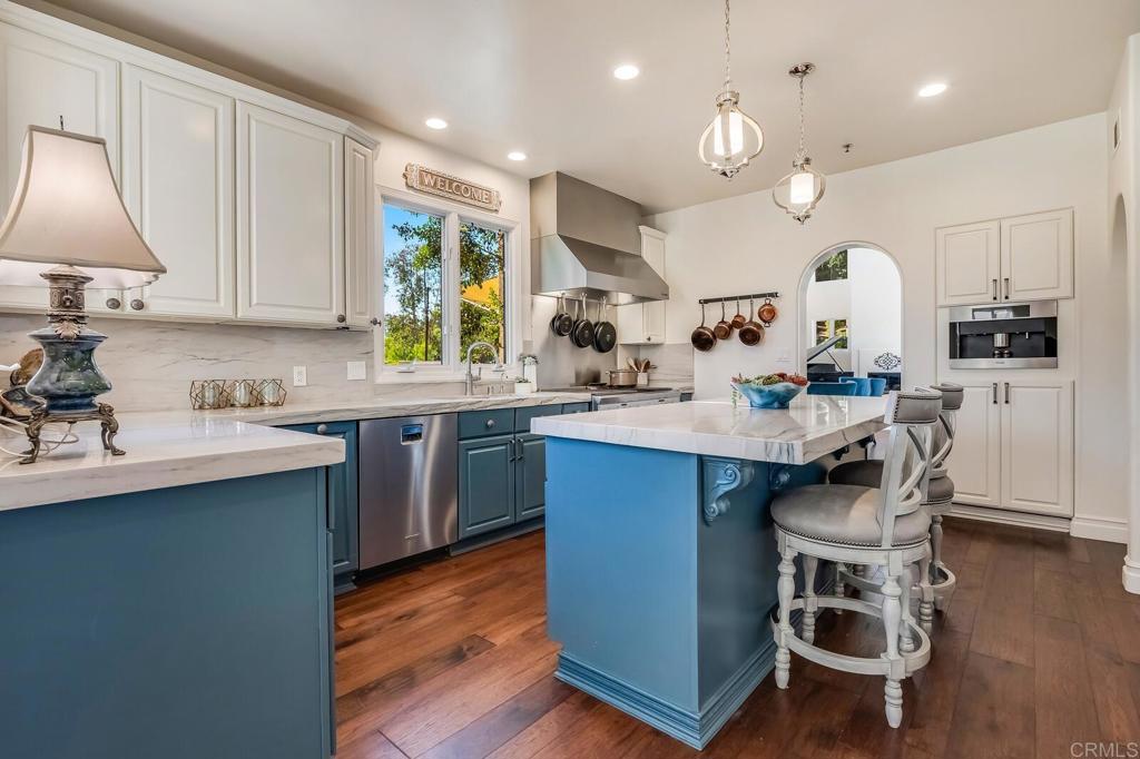 136 Hummingbird Hill Encinitas, CA 92024 - Photo 13 of 54 a kitchen with a sink cabinets and window