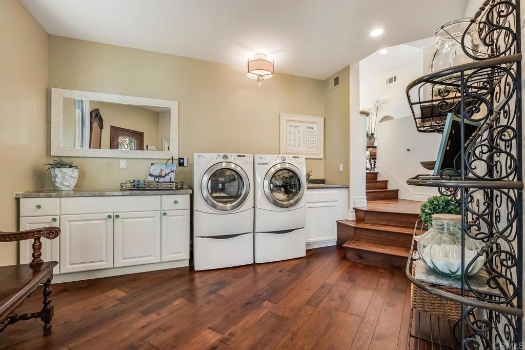136 Hummingbird Hill Encinitas, CA 92024 - Photo 21 of 54 a view of a storage & utility room with racks on the wall