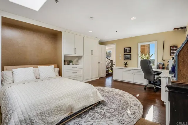 a bedroom with a bed and a fireplace