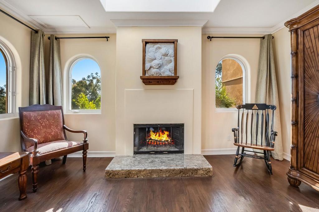 136 Hummingbird Hill Encinitas, CA 92024 - Photo 28 of 54 a living room with furniture and a fireplace
