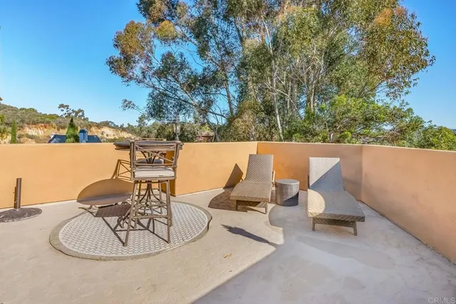 a spacious bathroom with a tub sink and mirror