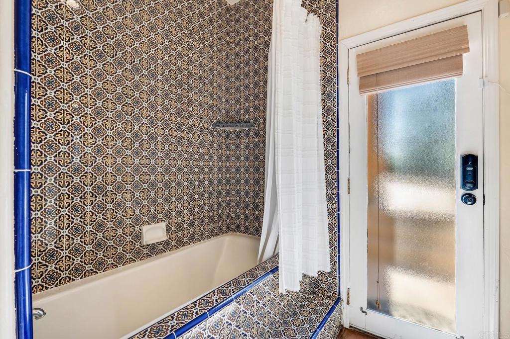 136 Hummingbird Hill Encinitas, CA 92024 - Photo 36 of 54 a bathroom with a bathtub and a shower