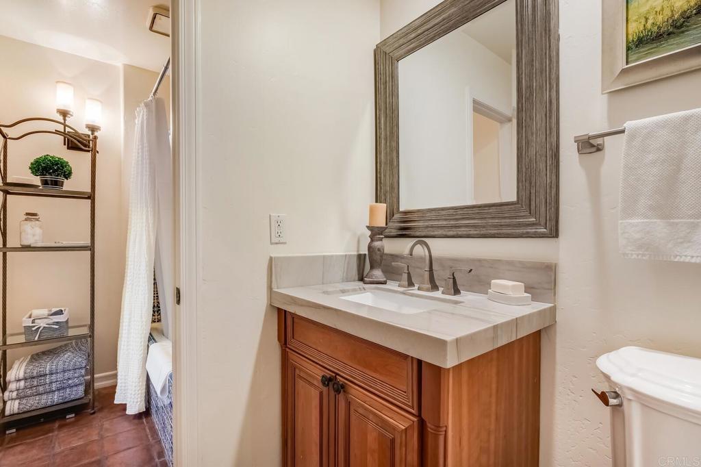 136 Hummingbird Hill Encinitas, CA 92024 - Photo 41 of 54 a bathroom with a sink and a mirror