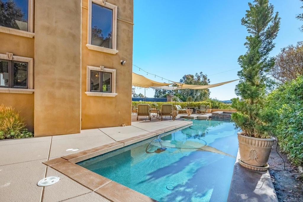 136 Hummingbird Hill Encinitas, CA 92024 - Photo 47 of 54 a view of a patio with couches and potted plants