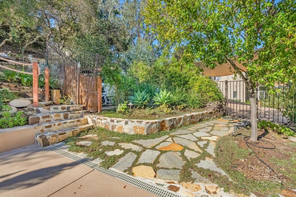 136 Hummingbird Hill Encinitas, CA 92024 - Photo 49 of 54 a view of a house with a yard