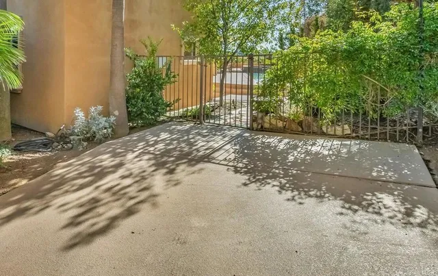 a view of an chairs and table in patio