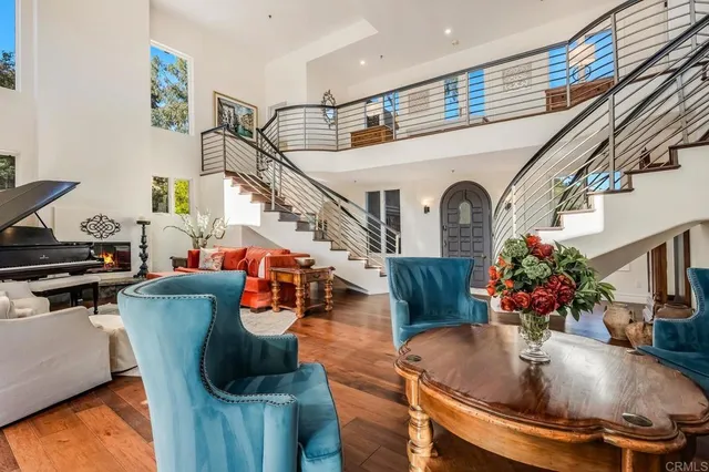 a lobby with furniture and a potted plant