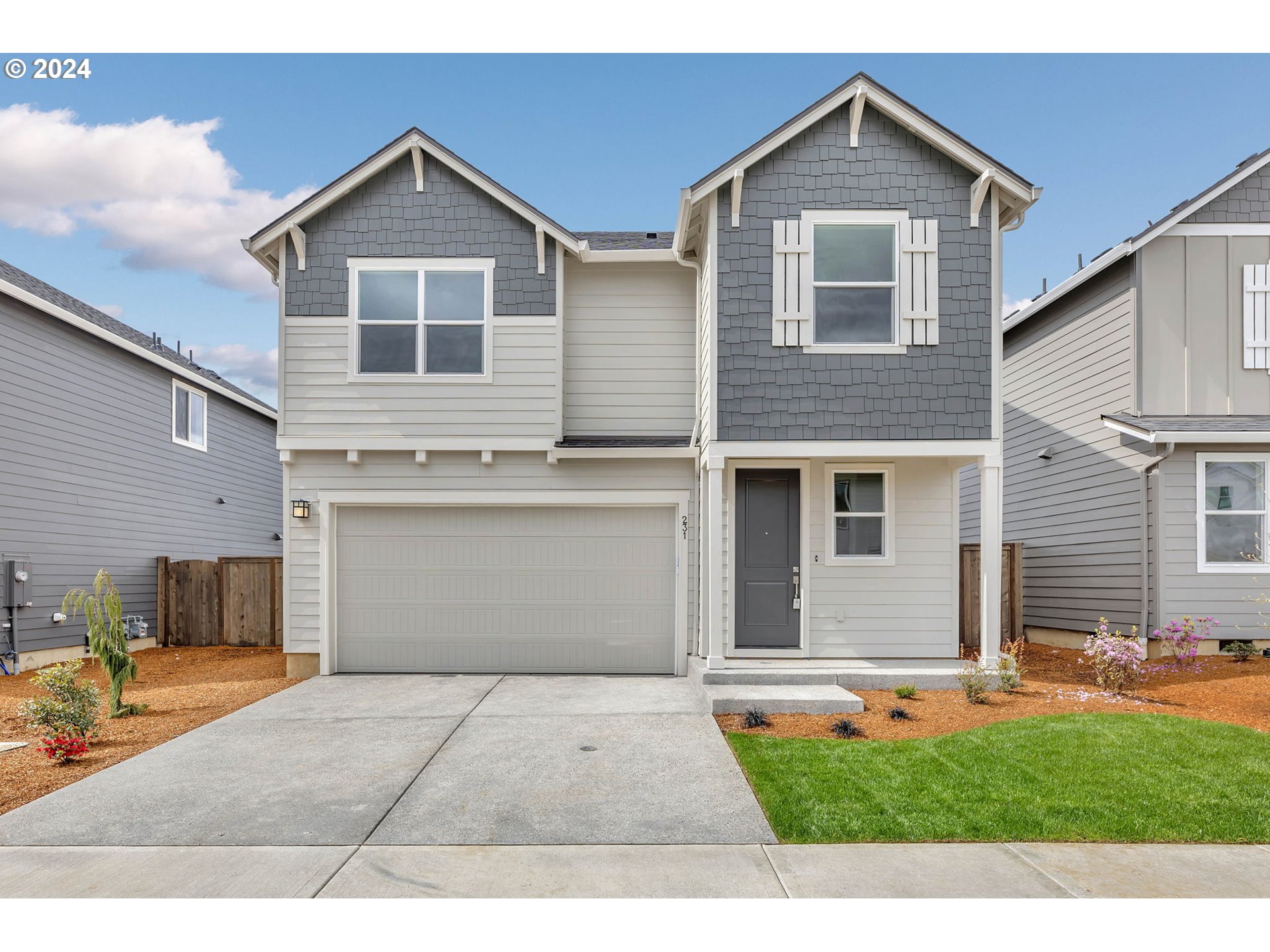 231 South 87th Avenue Ridgefield, WA 98642 - Photo 1 of 33 a front view of a house with a yard and garage