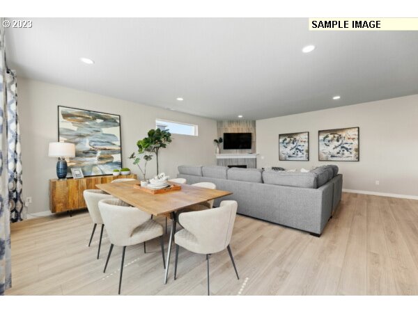 231 South 87th Avenue Ridgefield, WA 98642 - Photo 18 of 33 a view of a dining room with furniture and wooden floor