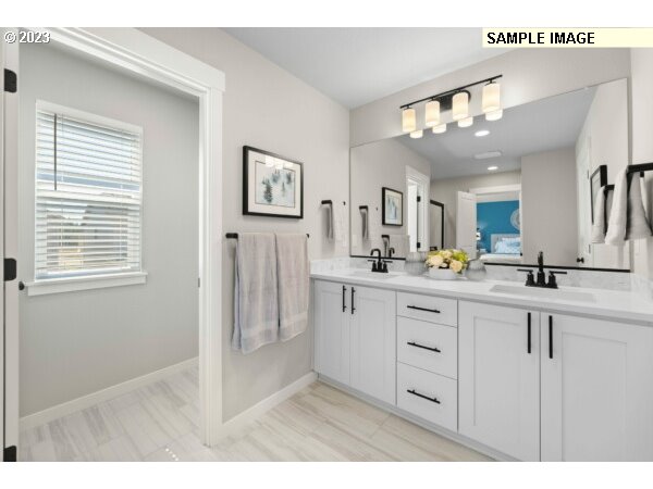 231 South 87th Avenue Ridgefield, WA 98642 - Photo 20 of 33 a bathroom with a sink a mirror and shower