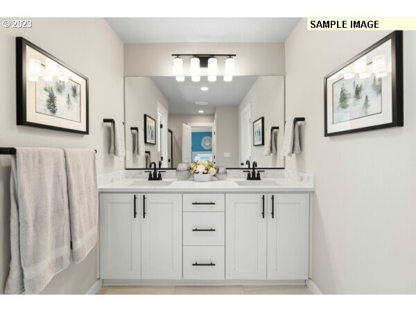 231 South 87th Avenue Ridgefield, WA 98642 - Photo 21 of 33 a bathroom with a double vanity sink and a mirror