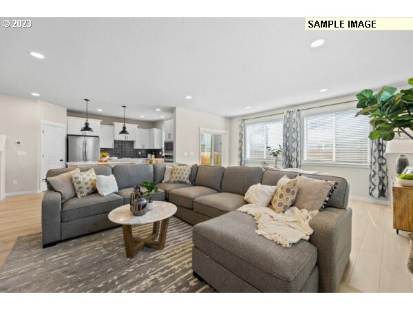 231 South 87th Avenue Ridgefield, WA 98642 - Photo 8 of 33 a living room with furniture and a large window