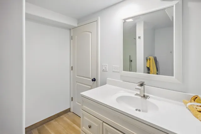 a bathroom with a sink and a mirror