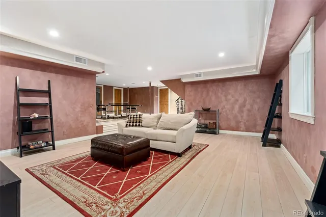 a view of a patio with table and chairs under an umbrella