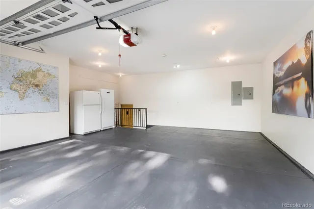 a view of a patio with a table and chairs next to a yard