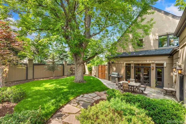 a view of a porch with furniture and garden