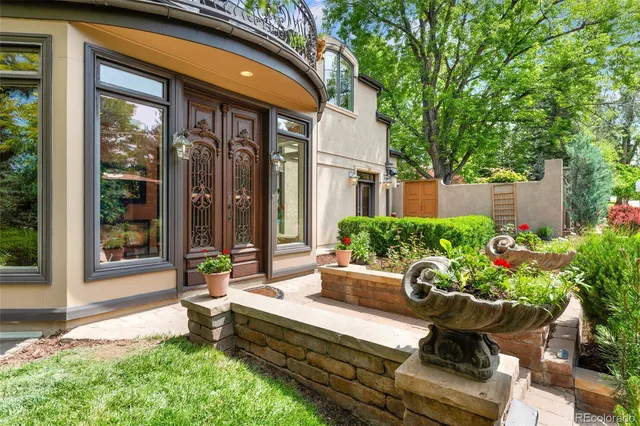 a house view with a seating space and garden space