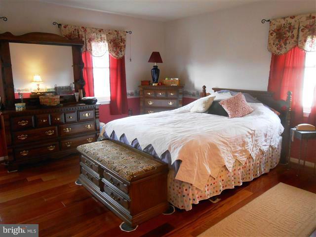 3810 Misty Hollow Point of Rocks, MD 21777 - Photo 13 of 29 a bedroom with a bed and a flat screen tv
