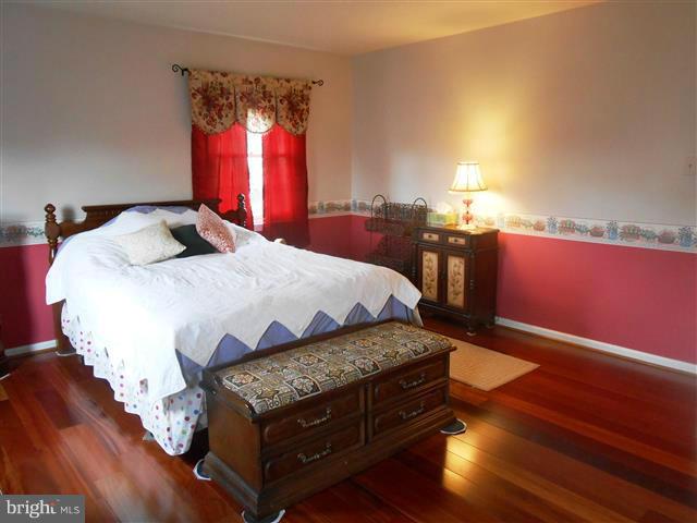 3810 Misty Hollow Point of Rocks, MD 21777 - Photo 14 of 29 a bedroom with a bed and window