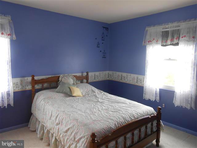 3810 Misty Hollow Point of Rocks, MD 21777 - Photo 17 of 29 a large bed sitting in a bedroom next to a window