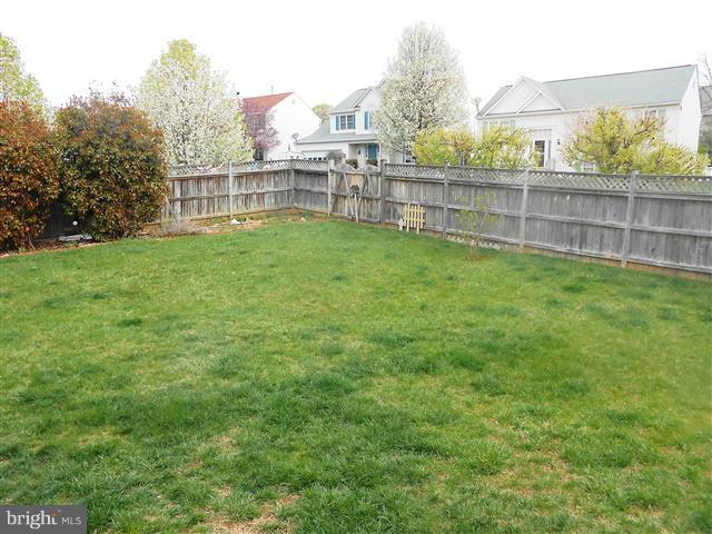 3810 Misty Hollow Point of Rocks, MD 21777 - Photo 19 of 29 a view of a backyard with a large trees and wooden fence