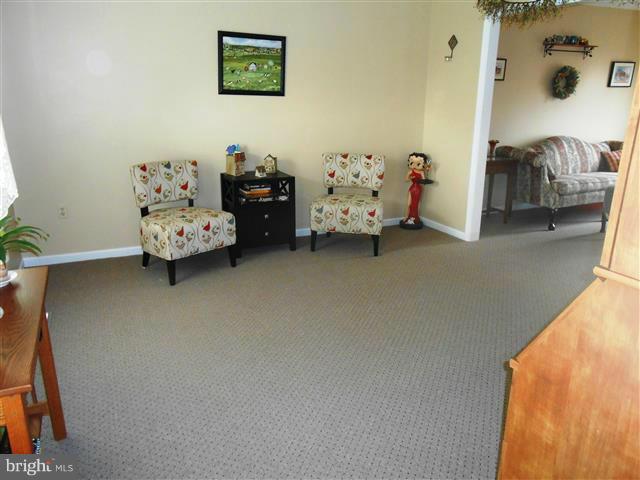 3810 Misty Hollow Point of Rocks, MD 21777 - Photo 10 of 29 a bedroom with a bed and a couch
