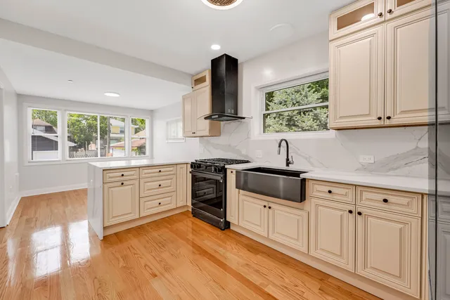 a kitchen with white cabinets and appliances