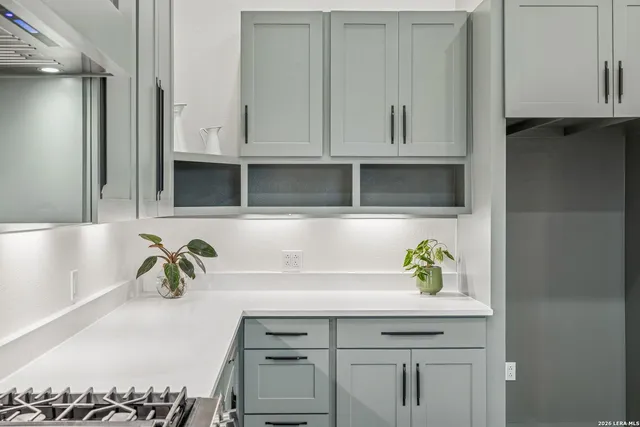 a bathroom with a double vanity sink and mirror