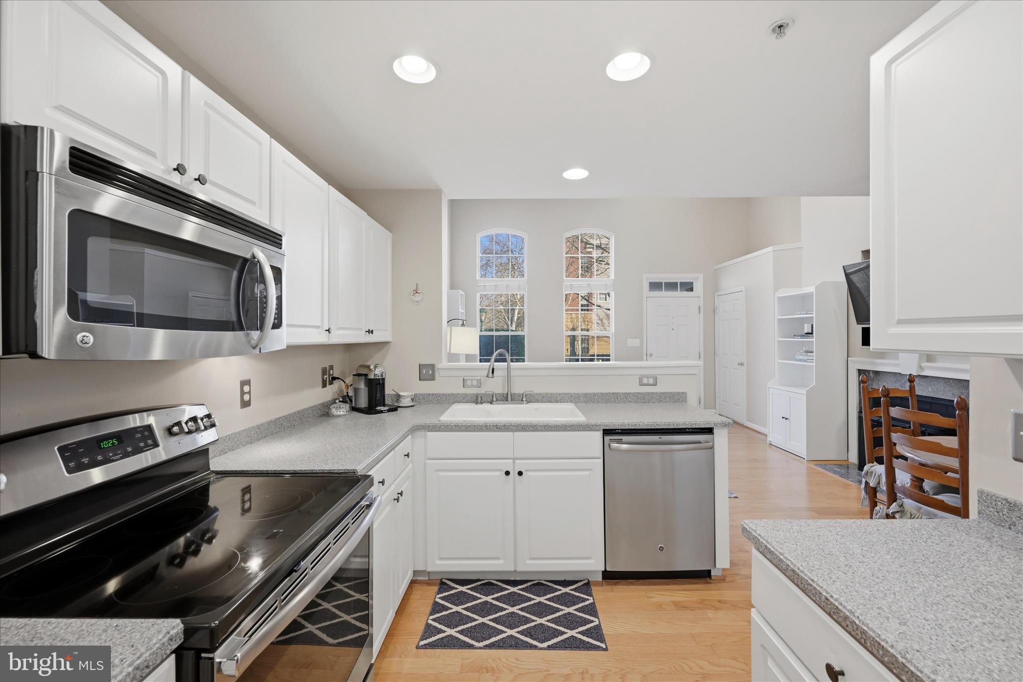 1906 Crescent Park Drive, Unit 35A Reston, VA 20190 - Photo 18 of 37 a kitchen with stainless steel appliances a sink stove and cabinets