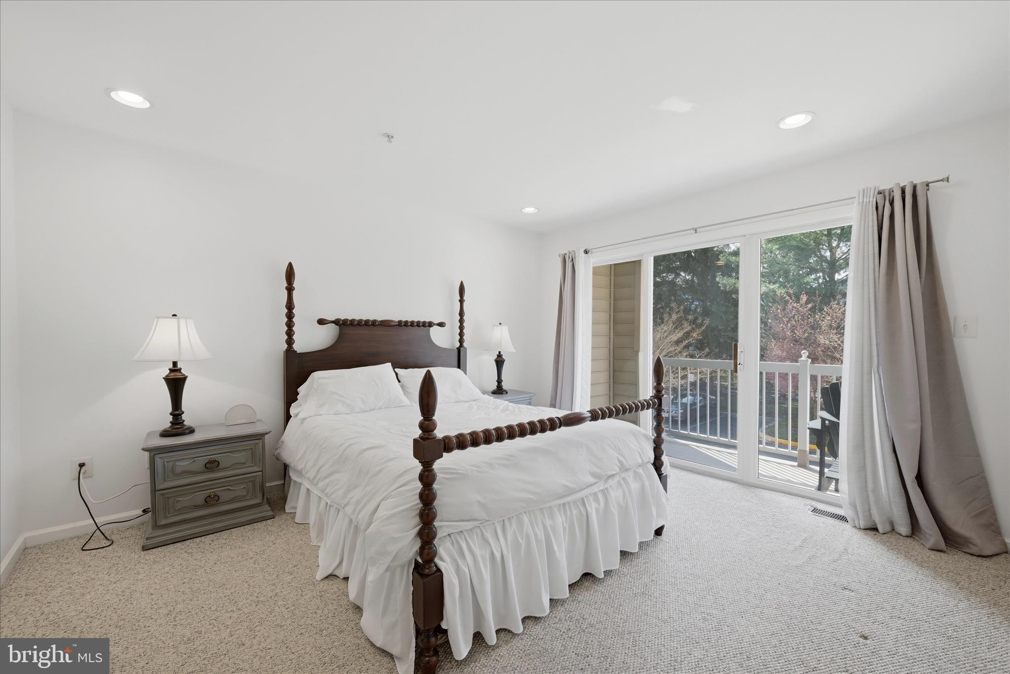 1906 Crescent Park Drive, Unit 35A Reston, VA 20190 - Photo 30 of 37 a bedroom with a bed and a large window