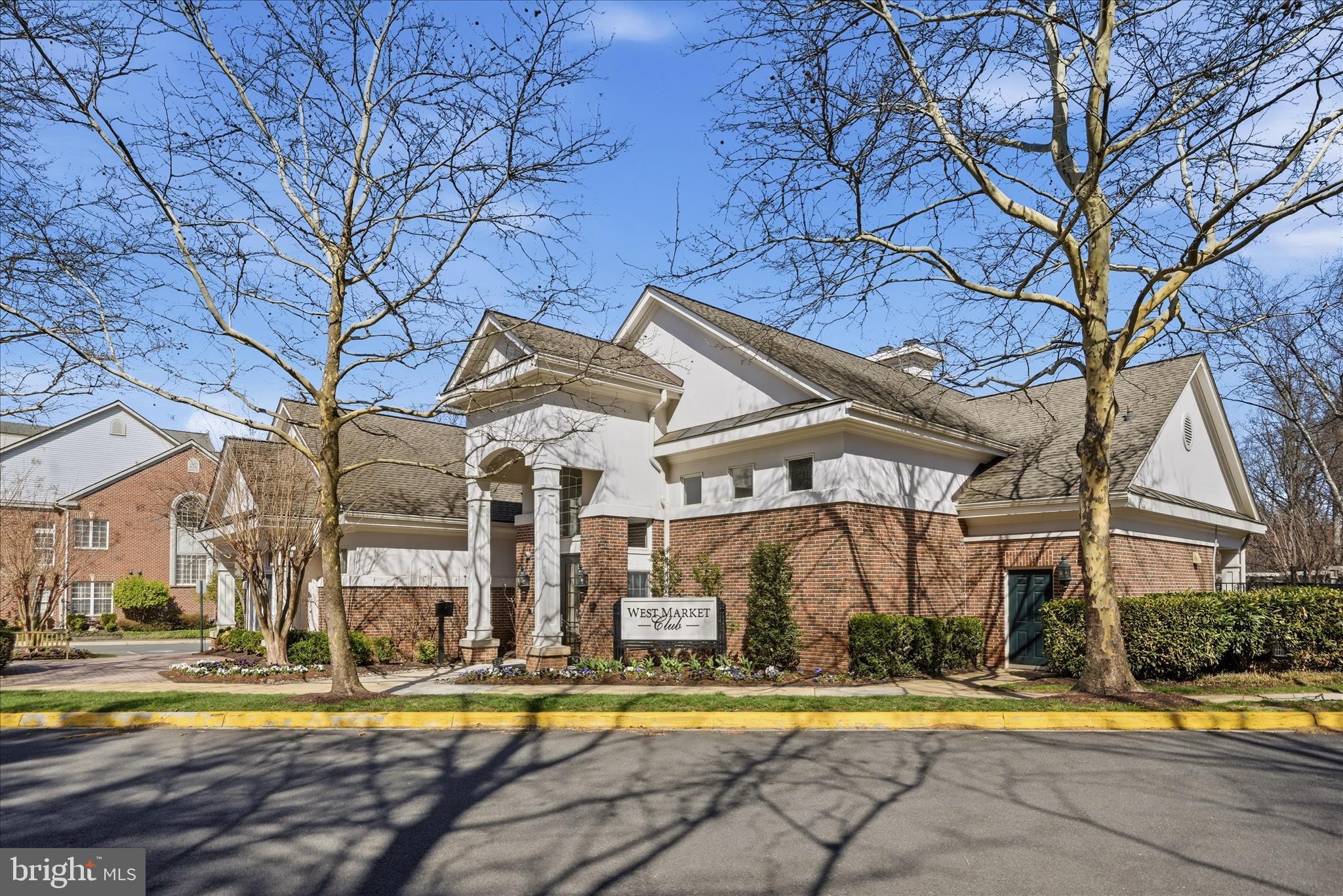 1906 Crescent Park Drive, Unit 35A Reston, VA 20190 - Photo 37 of 37 a view of a building with a swimming pool and a big yard