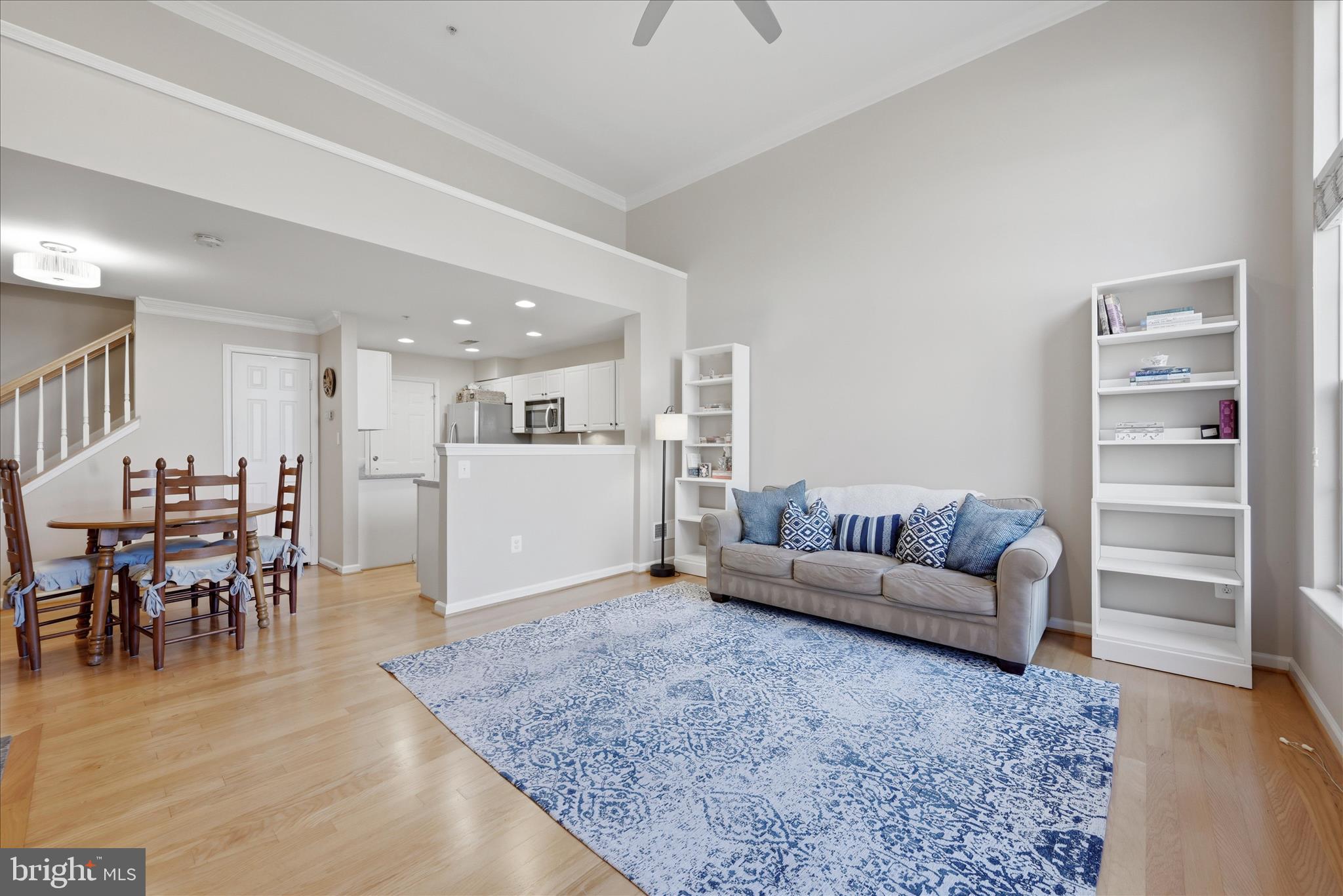 1906 Crescent Park Drive, Unit 35A Reston, VA 20190 - Photo 6 of 37 a living room with furniture and a dining table with kitchen view