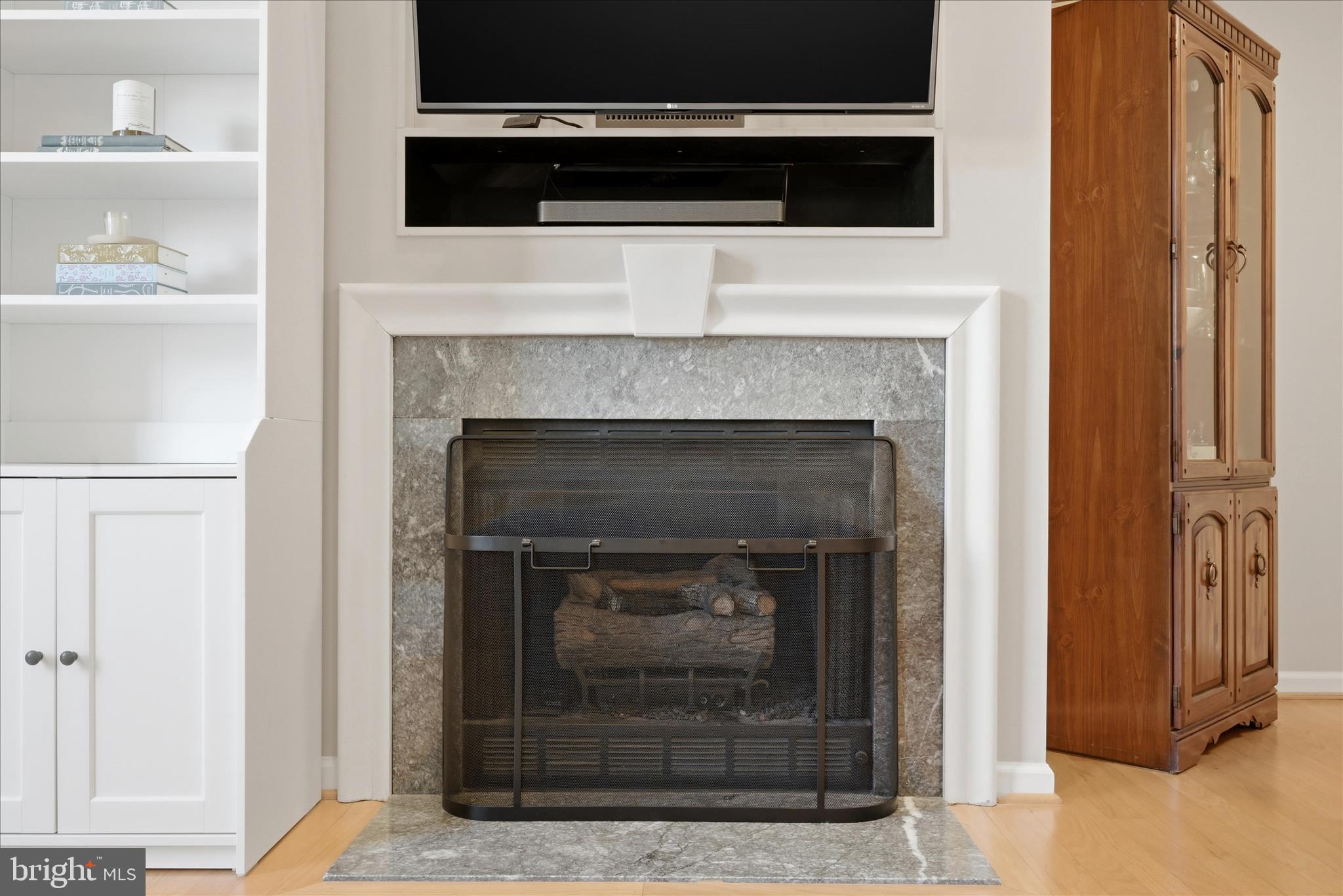 1906 Crescent Park Drive, Unit 35A Reston, VA 20190 - Photo 8 of 37 a living room with a fireplace