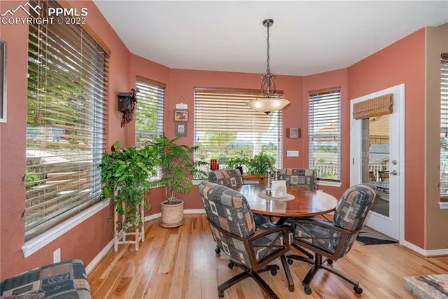 a bedroom with a bed and glass window