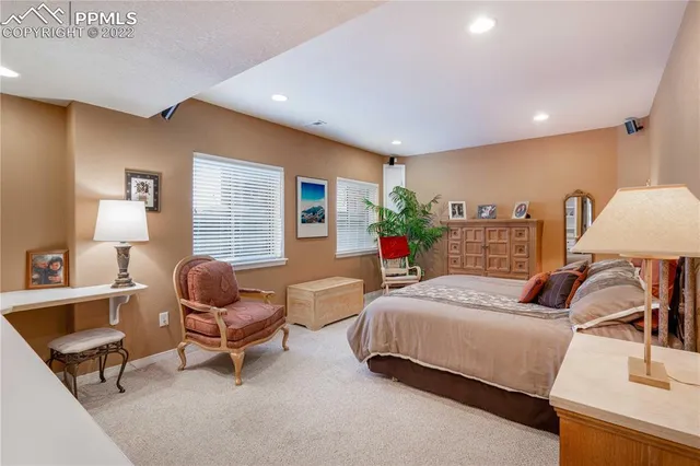 a bathroom with a granite countertop sink toilet and a mirror