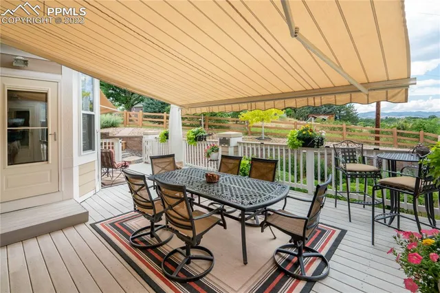 a view of a swimming pool with sitting area