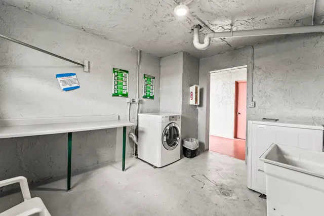 a utility room with closet dryer and washer