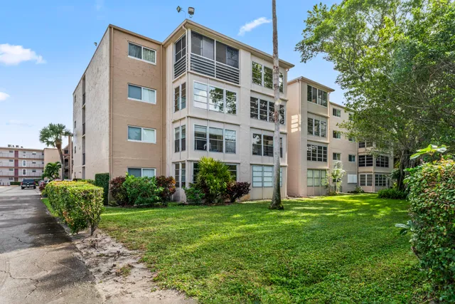 a front view of a building with garden