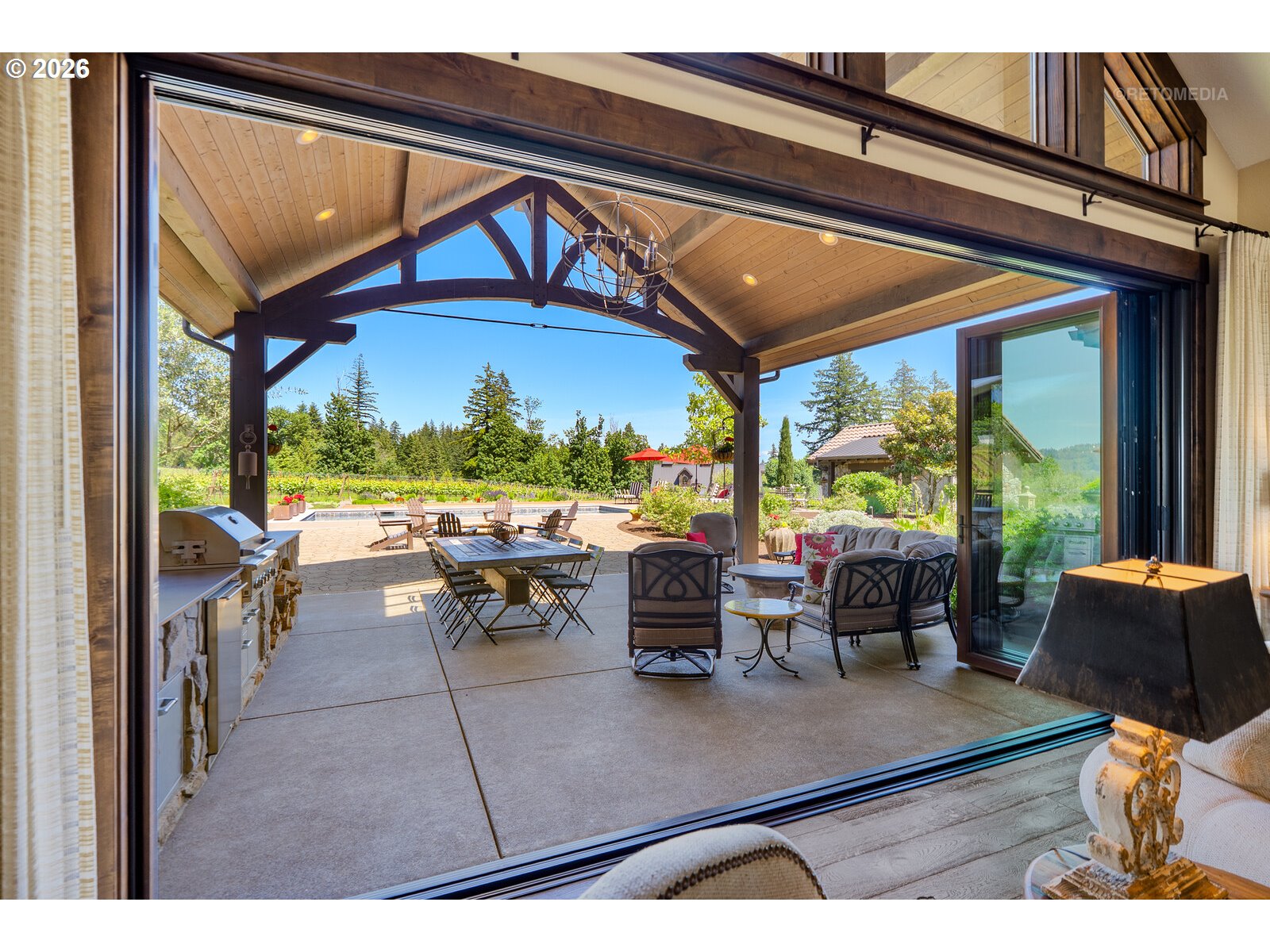 30460 Northeast Bell Road Newberg, OR 97132 - Photo 26 of 48 a view of a patio with dining table and chairs