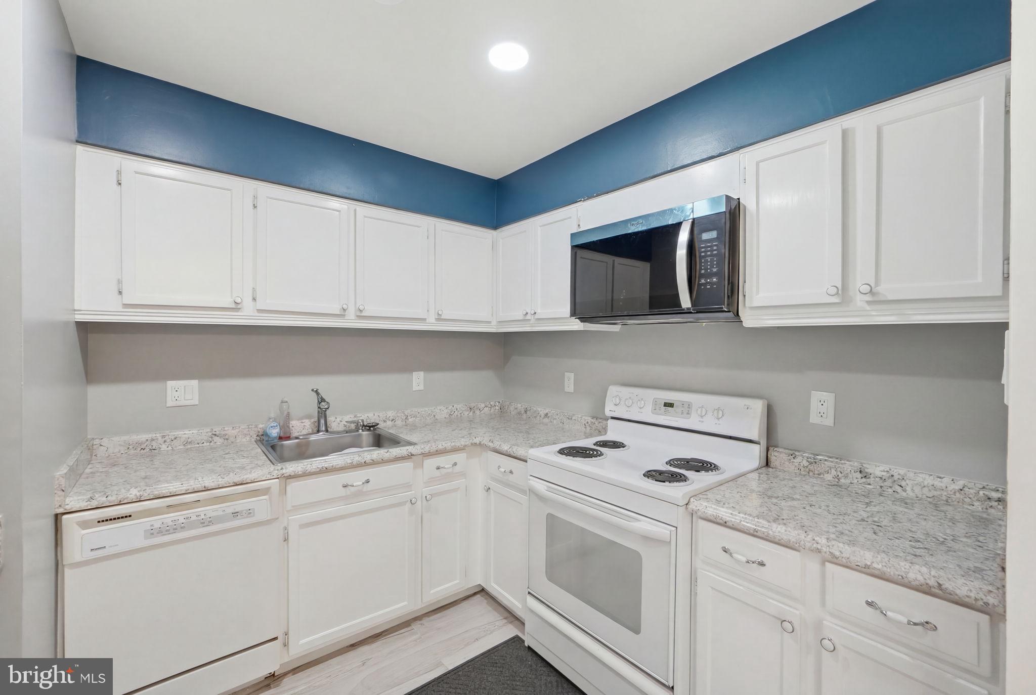 6141 Edsall Road, Unit E Alexandria, VA 22304 - Photo 9 of 16 Modern kitchen with sleek finishes.
