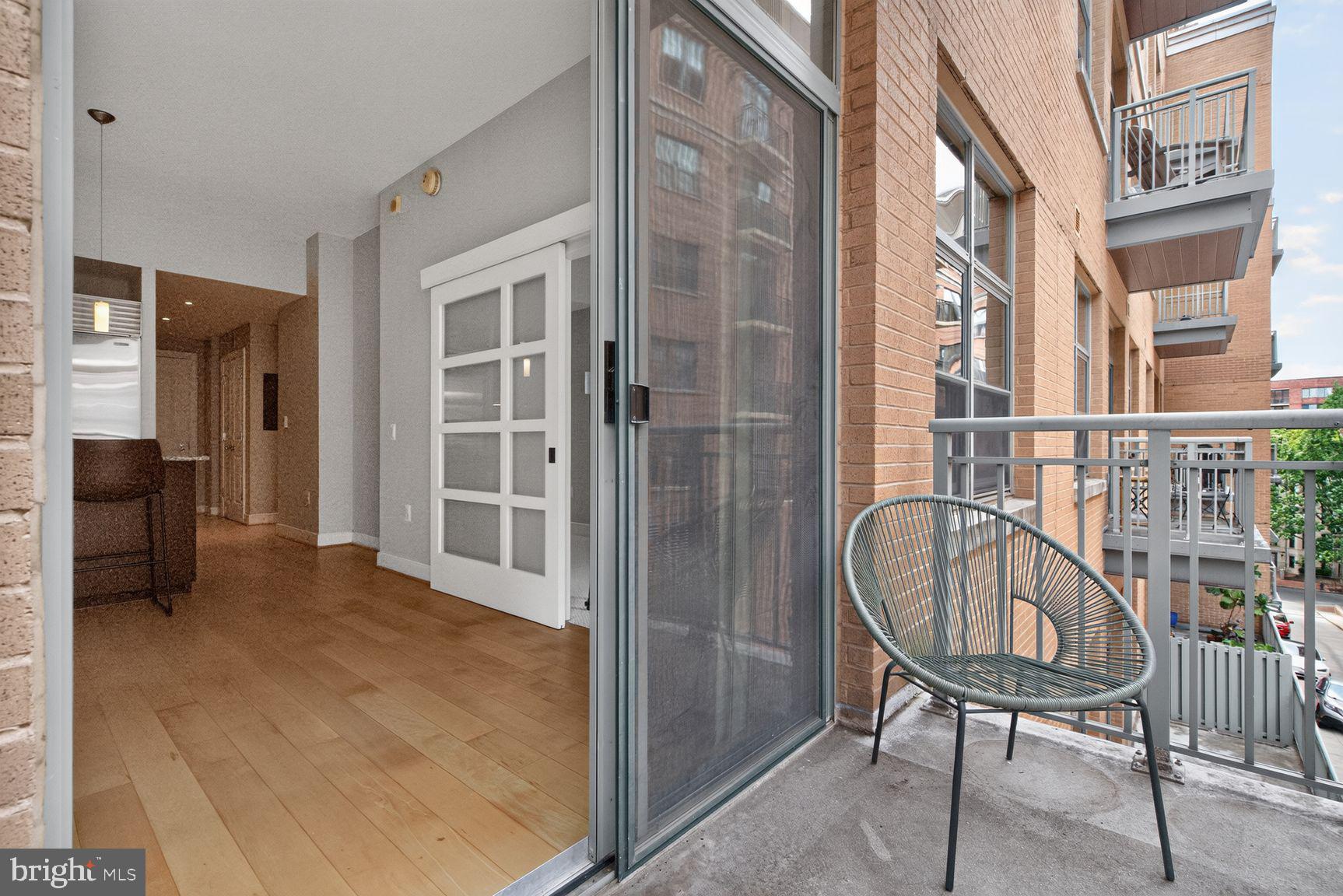2425 L Street Northwest, Unit 421 Washington, DC 20037 - Photo 9 of 20 Charming balcony with urban views.