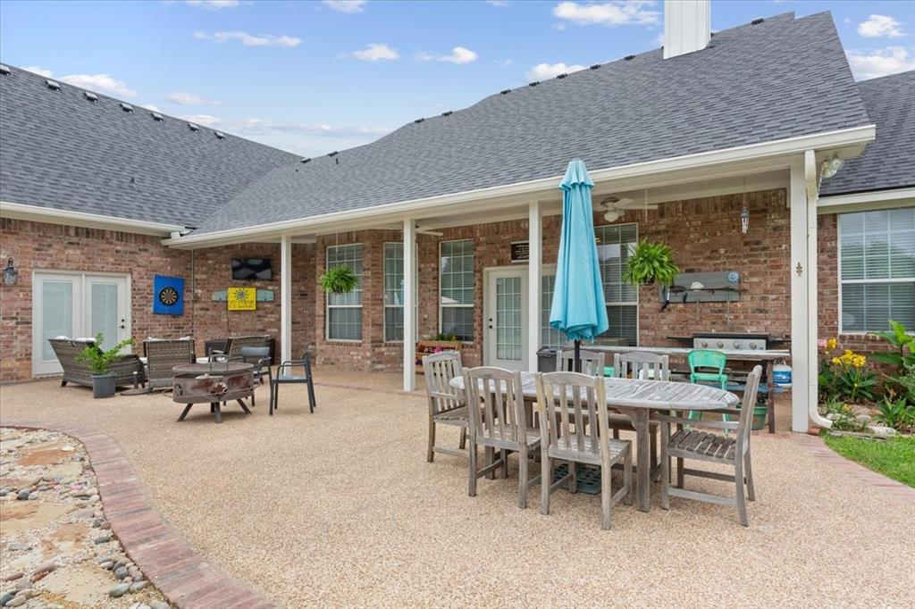 5616 Landsdown Drive Waco, TX 76708 - Photo 26 of 33 Expansive covered patio featuring a brick exterior and multiple access points